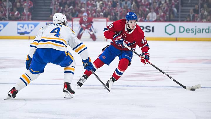 May 16, 2026; Montreal, Quebec, CAN; Montreal Canadiens defenseman Lane Hutson (48) plays the puck against Buffalo Sabres defenseman Bowen Byram (4) during the first period in game six of the second round of the 2026 Stanley Cup Playoffs at Bell Centre. Mandatory Credit: David Kirouac-Imagn Images