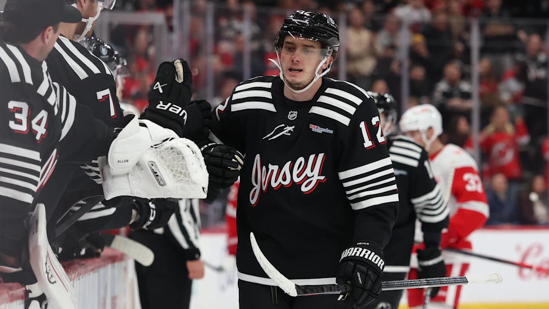 Nov 24, 2025; Newark, New Jersey, USA; New Jersey Devils center Cody Glass (12) celebrates his goal against the Detroit Red Wings during the first period at Prudential Center. Mandatory Credit: Ed Mulholland-Imagn Images