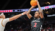 Mar 12, 2025; Kansas City, MO, USA; Cincinnati Bearcats guard Jizzle James (2) shoots the ball during the second half against the Iowa State Cyclones at T-Mobile Center. Mandatory Credit: William Purnell-Imagn Images