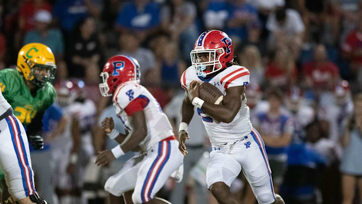 Makael Williams (20) carries the ball during the Pace vs Catholic football game at Pensacola Catholic High School on Friday, Aug. 30, 2024. Makael Williams (20) carries the ball during the Pace vs Catholic football game at Pensacola Catholic High School on Friday, Aug. 30, 2024.