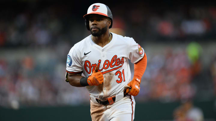 Jun 12, 2024; Baltimore, Maryland, USA; Baltimore Orioles outfielder Cedric Mullins (31) hits a double during the third inning against the Atlanta Braves at Oriole Park at Camden Yards.