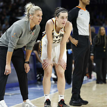 Indiana Fever head coach Christie Sides talks with guard Caitlin Clark 