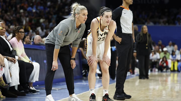 Indiana Fever head coach Christie Sides talks with guard Caitlin Clark 