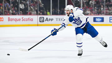 Jan 18, 2025; Montreal, Quebec, CAN; Toronto Maple Leafs defenseman Conor Timmins (25) shoots the puck against the Montreal Canadiens during the first period at Bell Centre. Mandatory Credit: David Kirouac-Imagn Images