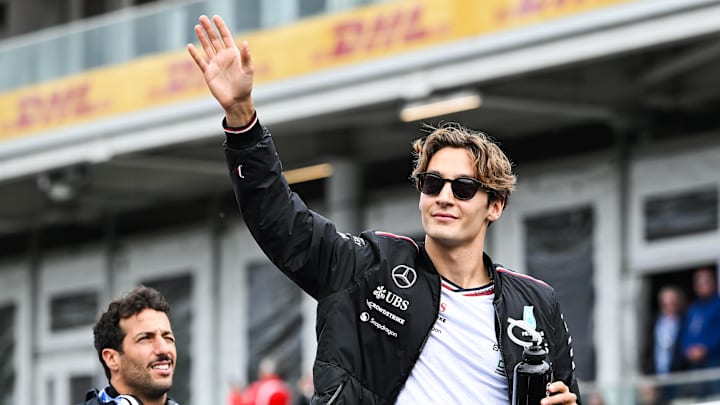 Jun 9, 2024; Montreal, Quebec, CAN; Mercedes driver George Russell (GBR) salutes the crowd during the drivers parade of the Canadien Grand Prix at Circuit Gilles Villeneuve. Mandatory Credit: David Kirouac-Imagn Images