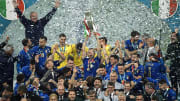Leonardo Bonucci of Italy holds the trophy while the italian...