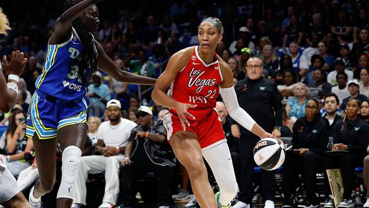 Jun 15, 2026; Arlington, Texas, USA; Las Vegas Aces center A'ja Wilson (22) controls the ball as Dallas Wings forward Awak Kuier (34) defends during the first half at College Park Center. Mandatory Credit: Chris Jones-Imagn Images