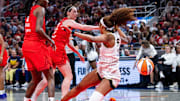 May 17, 2025; Indianapolis, Indiana, USA; Indiana Fever guard Caitlin Clark (22) fouls Chicago Sky forward Angel Reese (5)  in the second half at Gainbridge Fieldhouse. Mandatory Credit: Trevor Ruszkowski-Imagn Images