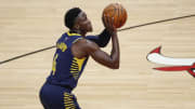 Dec 26, 2020; Chicago, Illinois, USA; Indiana Pacers guard Victor Oladipo (4) shoots a free throw against the Chicago Bulls during the second half of an NBA game at United Center. Mandatory Credit: Kamil Krzaczynski-USA TODAY Sports