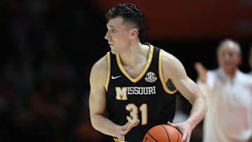 Feb 5, 2025; Knoxville, Tennessee, USA; Missouri Tigers guard Caleb Grill (31) brings the ball up court against the Tennessee Volunteers during the second half at Thompson-Boling Arena at Food City Center. Mandatory Credit: Randy Sartin-Imagn Images