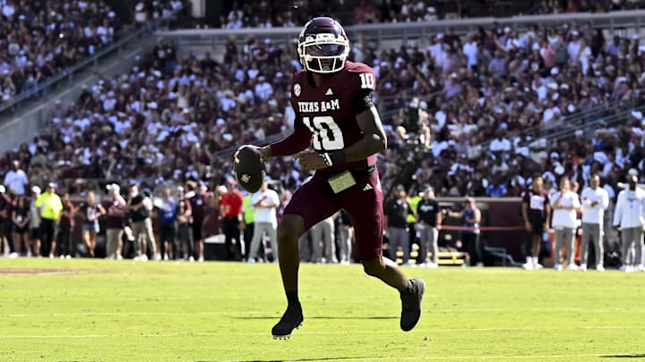 Texas A&M Aggies quarterback Marcel Reed (10) runs the ball during the first half against the Auburn Tigers at Kyle Field. Texas A&M Aggies quarterback Marcel Reed (10) runs the ball during the first half against the Auburn Tigers at Kyle Field.