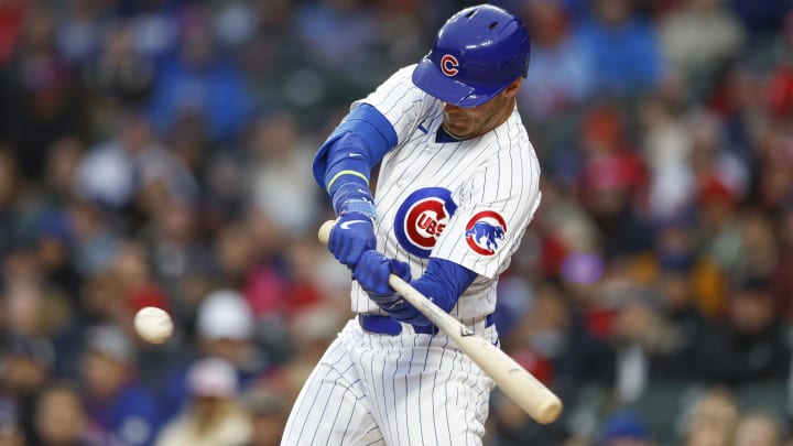 May 8, 2023; Chicago, Illinois, USA; Chicago Cubs center fielder Cody Bellinger (24) singles against the St. Louis Cardinals during the first inning at Wrigley Field.