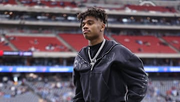 Jan 11, 2025; Houston, Texas, USA; Houston Texans wide receiver Tank Dell (3) walks on the field with crutches prior to the game against the Los Angeles Chargers in an AFC wild card game at NRG Stadium. Mandatory Credit: Troy Taormina-Imagn Images