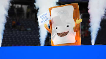 The Cinnamon Pop-Tart mascot goes into a toaster to be toasted after the Iowa State Cyclones defeatied the Miami Hurricanes at Camping World Stadium. 