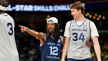 Grizzlies' Ja Morant (12) congratulates Lawson Lovering (34) after he took part in the skills challenge during open practice at the FedExForum on October 4, 2025, in Memphis, Tenn.
