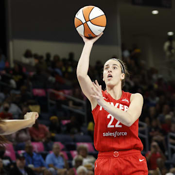 Aug 30, 2024; Chicago, Illinois, USA; Indiana Fever guard Caitlin Clark (22) shoots against Chicago Sky forward Angel Reese (5) during the first half at Wintrust Arena. Mandatory Credit: Kamil Krzaczynski-Imagn Images