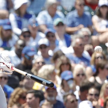 Jul 19, 2024; Chicago, Illinois, USA; Arizona Diamondbacks first baseman Christian Walker (53) hits a two-run single against the Chicago Cubs during the third inning at Wrigley Field. Mandatory Credit: Kamil Krzaczynski-USA TODAY Sports