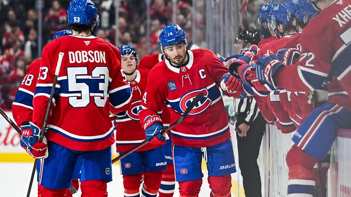 Oct 20, 2026; Montreal, Quebec, CAN;  Montreal Canadiens center Nick Suzuki (14) celebrates with his teammates at the bench his goal against the San Jose Sharks during the first period at Bell Centre.  Mandatory Credit: David Kirouac-Imagn Images