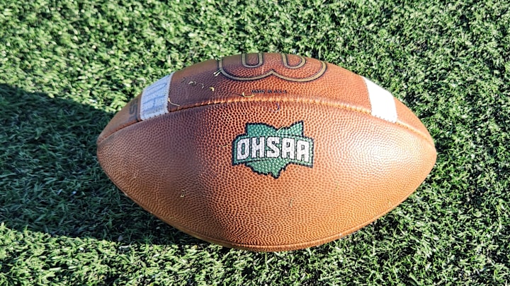 An OHSAA football sits on the field An OHSAA football sits on the field