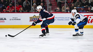 Feb 13, 2025; Montreal, Quebec, CAN; [Imagn Images direct customers only] Team USA defenseman Noah Hanifin (15) plays the puck against Team Finland in the second period during a 4 Nations Face-Off ice hockey game at Bell Centre. Mandatory Credit: David Kirouac-Imagn Images