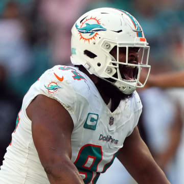 Dec 17, 2023; Miami Gardens, Florida, USA; Miami Dolphins defensive tackle Christian Wilkins (94) celebrates after tacking New York Jets safety Ashtyn Davis (not pictured) during the first half at Hard Rock Stadium. Mandatory Credit: Jasen Vinlove-USA TODAY Sports