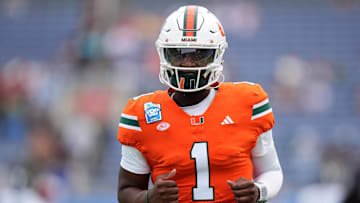 Dec 28, 2024; Orlando, FL, USA; Miami Hurricanes quarterback Cam Ward (1) warms up prior to the game against the Iowa State Cyclones at Camping World Stadium. Mandatory Credit: Jasen Vinlove-Imagn Images