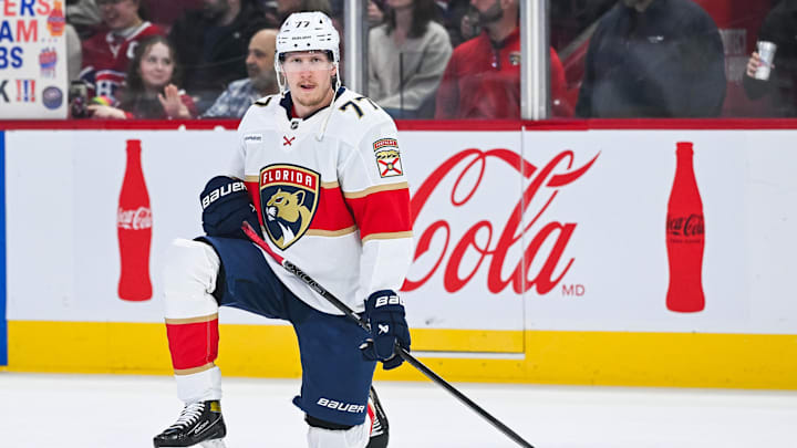 Mar 15, 2025; Montreal, Quebec, CAN; Florida Panthers defenseman Niko Mikkola (77) kneels on the ice in warm-up before the game against the Montreal Canadiens at Bell Centre. Mandatory Credit: David Kirouac-Imagn Images