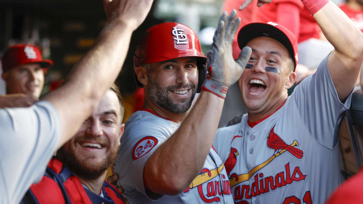 Aug 1, 2024; Chicago, Illinois, USA; St. Louis Cardinals first baseman Paul Goldschmidt (46) celebrates with teammates in the dugout after hitting a solo home run against the Chicago Cubs during the first inning at Wrigley Field. Mandatory Credit: Kamil Krzaczynski-USA TODAY Sports