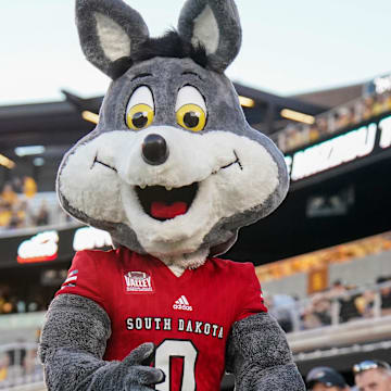 Aug 31, 2023; Columbia, Missouri, USA; The South Dakota Coyotes mascot performs against the Missouri Tigers during the first half at Faurot Field at Memorial Stadium. Mandatory Credit: Denny Medley-Imagn Images