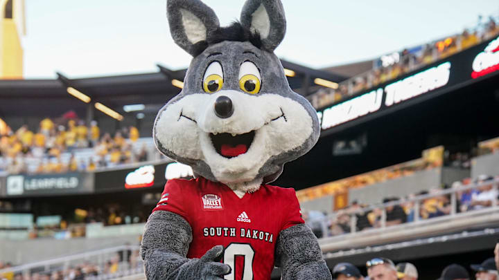 Aug 31, 2023; Columbia, Missouri, USA; The South Dakota Coyotes mascot performs against the Missouri Tigers during the first half at Faurot Field at Memorial Stadium. Mandatory Credit: Denny Medley-Imagn Images