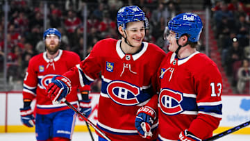 Apr 14, 2025; Montreal, Quebec, CAN; Montreal Canadiens right wing Ivan Demidov (93) celebrates with right wing Cole Caufield (13) after his first career goal against the Chicago Blackhawks in the first period at Bell Centre. Mandatory Credit: David Kirouac-Imagn Images
