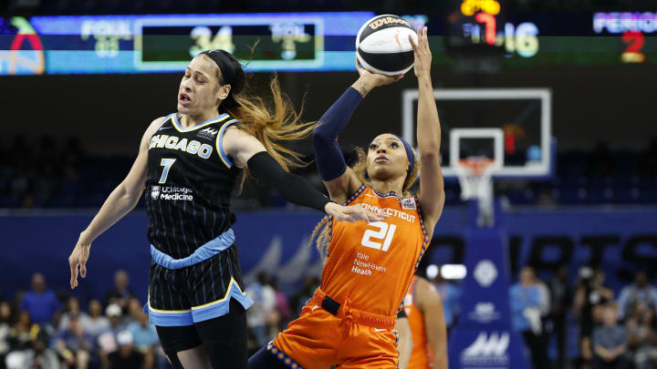 Jun 12, 2024; Chicago, Illinois, USA; Connecticut Sun guard DiJonai Carrington (21) shoots against Chicago Sky guard Chennedy Carter (7) during the first half of a basketball game at Wintrust Arena. Mandatory Credit: Kamil Krzaczynski-USA TODAY Sports