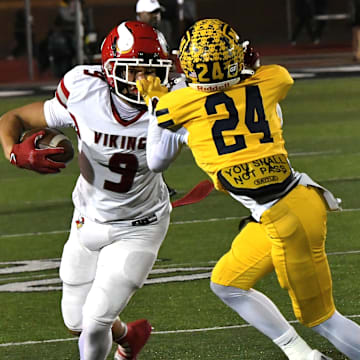 Moeller's Chris Bradley (24) grabs the face mask of Princeton's Landen Miree (9) in the OHSAA Division I football regional semifinals Nov. 15, 2024, at Dwire Field Mason, Ohio.