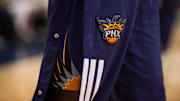 The Phoenix Suns logo before the game between the Dallas Mavericks and the Suns played at the American Airlines Center April 12, 2014.