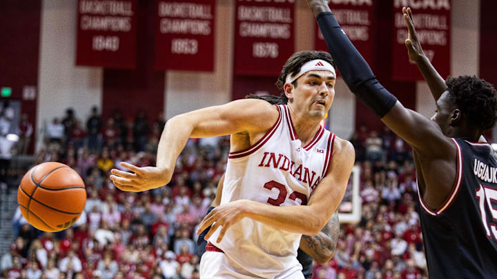Indiana guard Trey Galloway (32) passes the ball while South Carolina guard Morris Ugusuk (15) defends during a Nov. 16 game in Bloomington, Ind. 
