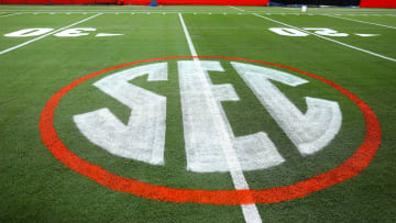 The SEC logo has a first coat of paint on the field at Ben Hill Griffin Stadium as the grounds crew