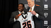 Vice president and director of athletics Scott Barnes, right, introduces JaMarcus Shephard as the new head coach for Oregon State football at Reser Stadium on Tuesday, Dec. 2, 2025, in Corvallis, Ore.