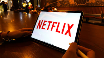 In this photo illustration, a Netflix logo is displayed on...