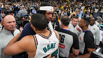 Mavericks' Anthony Davis (3) and Grizzlies' Desmond Bane (22) hug and speak to each other after the Grizzlies defeated the Mavericks 120-106 in the play-in game to secure a spot in the NBA Playoffs at FedExForum in Memphis, Tenn., on Friday, April 18, 2025.