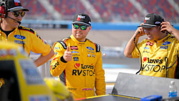 Layne Riggs gives his team a thumbs up on pit road during qualifying for Friday's NASCAR Craftsman Truck Series Championship Race at Phoenix Raceway.