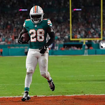 Sep 12, 2024; Miami Gardens, Florida, USA; Miami Dolphins running back De'Von Achane (28) scores a touchdown against the Buffalo Bills during the first half at Hard Rock Stadium.