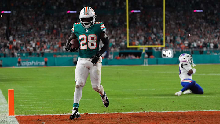 Sep 12, 2024; Miami Gardens, Florida, USA; Miami Dolphins running back De'Von Achane (28) scores a touchdown against the Buffalo Bills during the first half at Hard Rock Stadium.