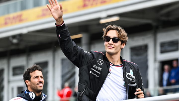 Jun 9, 2024; Montreal, Quebec, CAN; Mercedes driver George Russell (GBR) salutes the crowd during the drivers parade of the Canadien Grand Prix at Circuit Gilles Villeneuve. Mandatory Credit: David Kirouac-USA TODAY Sports