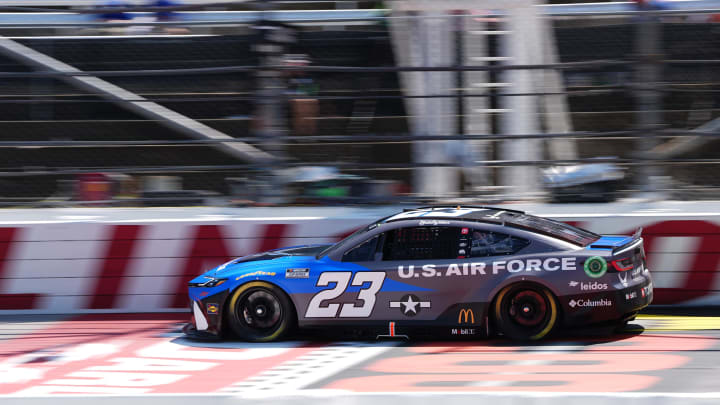 Aug 31, 2024; Darlington, South Carolina, USA; NASCAR Cup Series driver Bubba Wallace (23) during qualifying for the Cook Out Southern 500 at Darlington Raceway. 