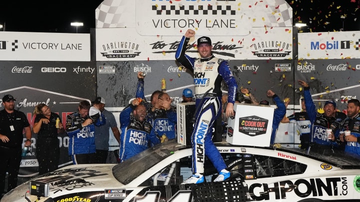 Sep 1, 2024; Darlington, South Carolina, USA; NASCAR Cup Series driver Chase Briscoe (14) celebrates after winning the Cook Out Southern 500 at Darlington Raceway.