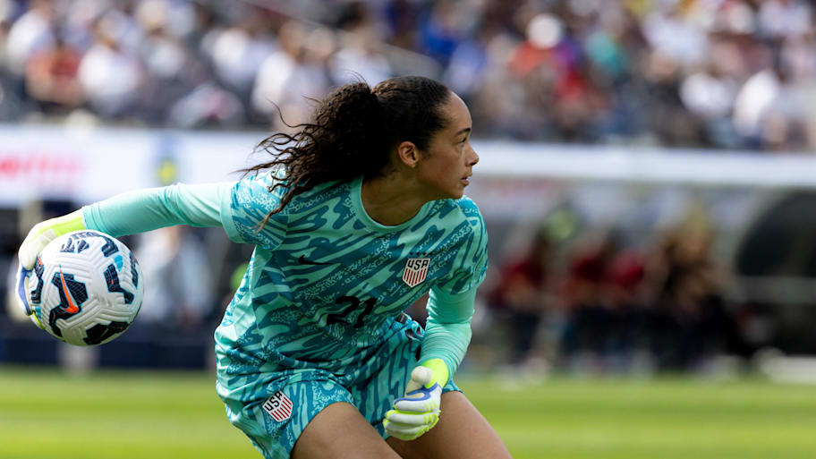 Goalkeeper Phallon Tullis-Joyce throws the ball