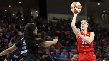 Aug 30, 2024; Chicago, Illinois, USA; Indiana Fever guard Caitlin Clark (22) shoots against Chicago Sky forward Angel Reese (5) during the first half at Wintrust Arena. Mandatory Credit: Kamil Krzaczynski-Imagn Images