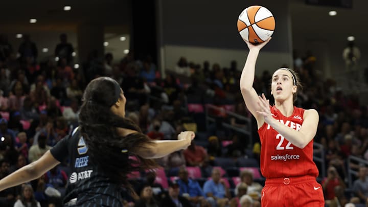 Aug 30, 2024; Chicago, Illinois, USA; Indiana Fever guard Caitlin Clark (22) shoots against Chicago Sky forward Angel Reese (5) during the first half at Wintrust Arena. Mandatory Credit: Kamil Krzaczynski-Imagn Images