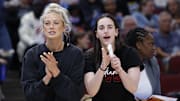 Jun 7, 2025; Chicago, Illinois, USA; Injured Indiana Fever guard Sophie Cunningham (8) and guard Caitlin Clark (22) react from the bench during the first half of a WNBA game against the Chicago Sky at United Center. Mandatory Credit: Kamil Krzaczynski-Imagn Images