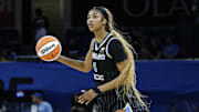 Chicago Sky forward Angel Reese controls the ball against the Minnesota Lynx.